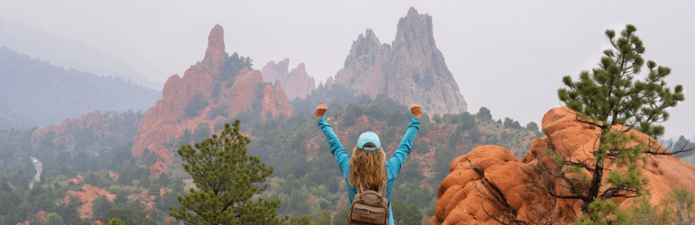 Woman enjoying beautiful scenery. Garden of the Gods, Colorado Springs, Colorado, USA.
